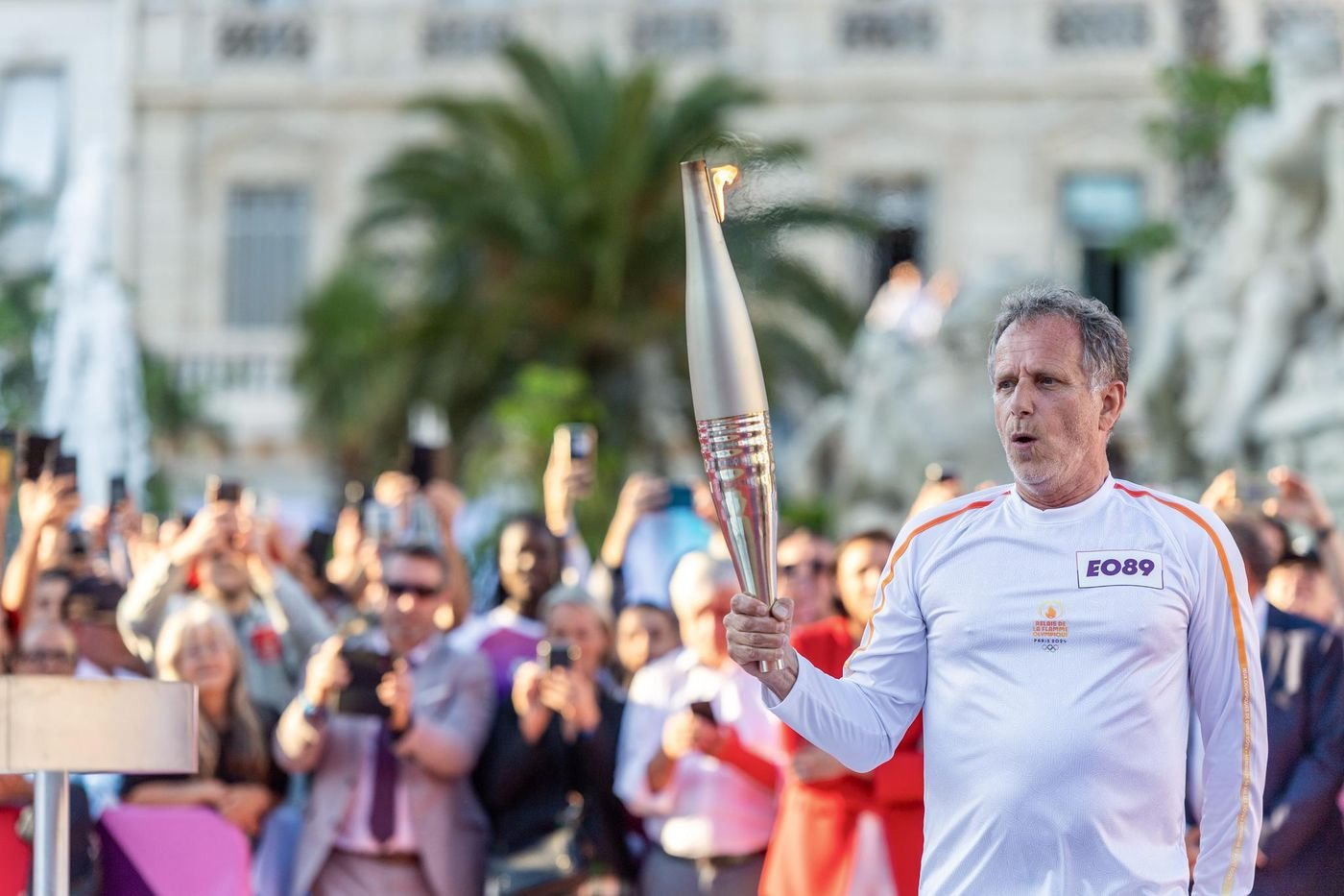 the Olympic flame on the steps at the Cannes Film Festival