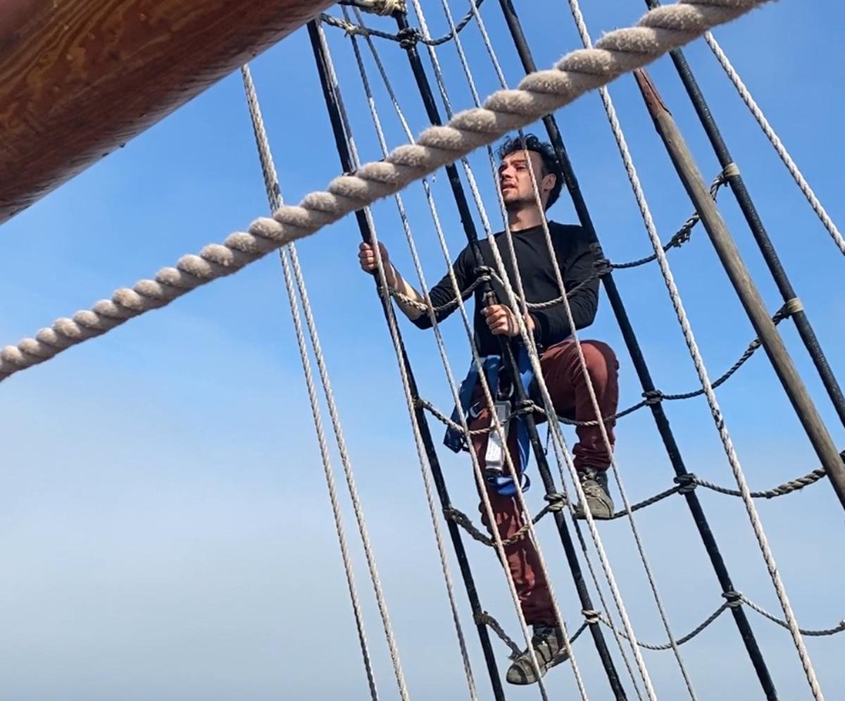 Sailors are tied up when they climb to the top of the masts.  Halfway, they reach an intermediate platform called a top.